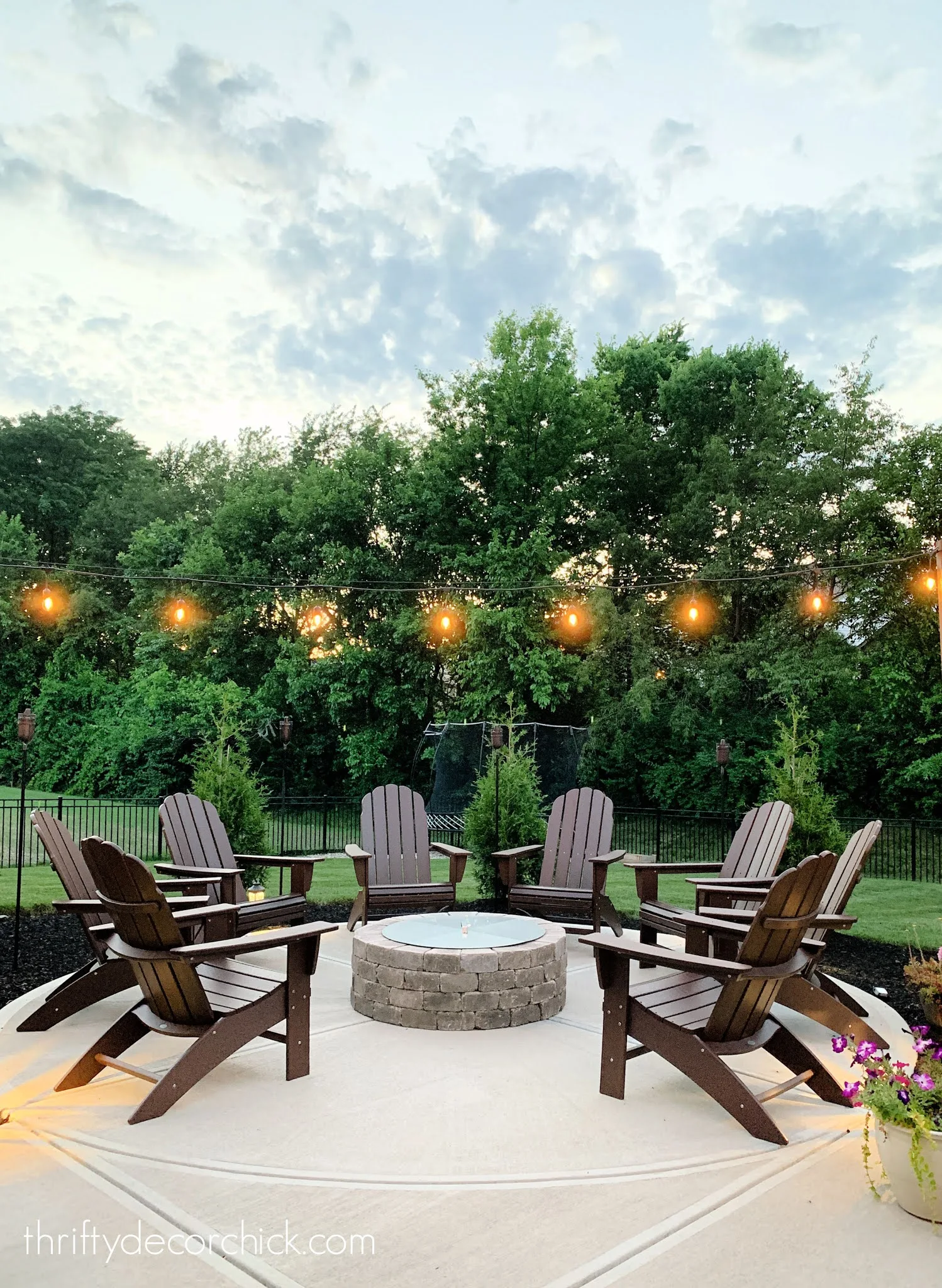 round fire pit Adirondack chairs